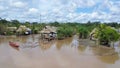 Typical and traditional indigene village with canoe boats on the Peruvian side of the Amazon River Royalty Free Stock Photo