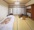 Traditional Japanese bedroom with a futon mattress that embodies the essence of Japanese design.