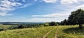 Eastern Hungarian hilly panorama with wheel tracks shot in Borsod county in beautiful summer daylight