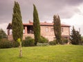Typical Tuscan farmhouse surrounded by cypress trees Royalty Free Stock Photo