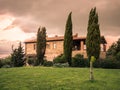 Typical Tuscan farmhouse surrounded by cypress trees Royalty Free Stock Photo