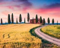 Typical Tuscan view with farmhouse and cypress trees. Colorful summer view of Italian countryside, Val d`Orcia valley, Pienza