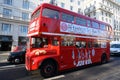 Red double decker bus for afternoon tea bus tour, City of London. Classic tour bus for tourists.