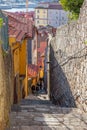 The typical very narrow and steep medieval street of the older parts of the city