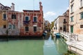 Typical view of boats and gondolas under on the canal of Venice. Royalty Free Stock Photo