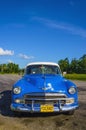 Typical view of classic blue American car on Cuba near Havana Royalty Free Stock Photo