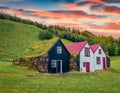 Typical view of Icelandic countryside architecture. Impressive summer sunrise in Skogar village