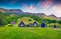 Typical view of Icelandic turf-top houses. Colorful summer sunrise in the Skogar village, south Iceland, Europe. Beauty of Royalty Free Stock Photo