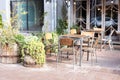 Empty cafe with terrace with tables and chairs. Street vintage exterior of restaurant. Furniture for coffee shop in street Royalty Free Stock Photo