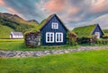 Typical view of turf-top houses in Icelandic countryside. Wonderful summer sunrise in Skogar village, south Iceland, Europe. Trave Royalty Free Stock Photo