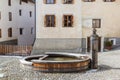 The typical village fountain made of wood, instead of stone elswhere, in Upper Engadin Royalty Free Stock Photo