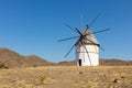 This typical white historical windmill is in the south of Spain. Royalty Free Stock Photo