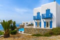 Typical white house with blue windows and balconies on Mykonos island, Greece Royalty Free Stock Photo