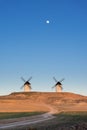 Typical windmill in with the moon at the background Royalty Free Stock Photo