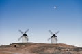 Typical windmill in with the moon at the background Royalty Free Stock Photo