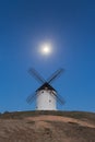 Typical windmill in with the moon at the background Royalty Free Stock Photo