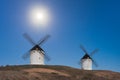 Typical windmill in with the moon at the background Royalty Free Stock Photo