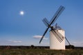 Typical windmill in with the moon at the background Royalty Free Stock Photo