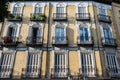 Typical windows and balconies in a house in Madrid