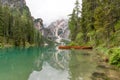 Typical wooden boats on Lake Braies with mist Royalty Free Stock Photo