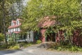 Typical wooden building with trees and street in Williamsville, Vermont, New England