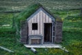 Typical wooden house with roof of green gras on iceland