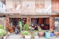 Typical wooden teak house with plantpots