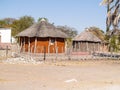 Typically circular thatched roof homes on fenced compound