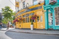 Typiical English street architecture in bright yellow and turquoise