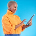 Typing, happy or black woman in studio with tablet to search social media on internet or blue background. Networking