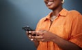 Typing, happy and hands with a phone on a dark background for communication or social media. Smile, contact and a black