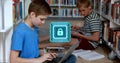 Typing left boy in blue-tshirt using laptop in school library aisle, padlock-hologram, copy space Royalty Free Stock Photo