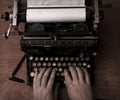 Typing on an old typewriter Royalty Free Stock Photo