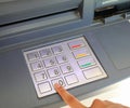 typing secret pin into ATM without being seen Royalty Free Stock Photo