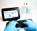 Typing on a wireless keyboard in the laboratory Royalty Free Stock Photo