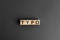 Typo - word from wooden blocks with letters