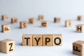 Typo - word from wooden blocks with letters