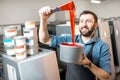 Typographer with paint at the manufacturing Royalty Free Stock Photo