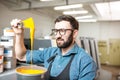 Typographer with paint at the manufacturing Royalty Free Stock Photo
