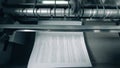 Typographic machine is issuing and relocating printed paper