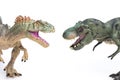 Tyrannosaurus and allosaurus toy on white