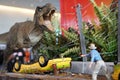 Tyrannosaurus dinosaur statue model, T-Rex attack the Jeep, Scene from Jurassic park movie Royalty Free Stock Photo