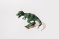 Tyrannosaurus rex on skateboard. White background.