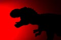 Tyrannosaurus shadow with red light