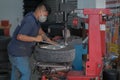 Tyre change on the car in a workshop by a mechanic Royalty Free Stock Photo