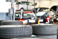 Tyre change in a garage - closeup tyre tread - stack tyres for s