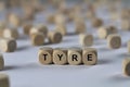 Tyre - cube with letters, sign with wooden cubes