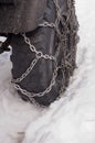 Tyre with chains Royalty Free Stock Photo