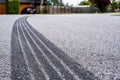 Tyre track on asphalt from hard braking.