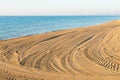 Tyre tracks on a beach Royalty Free Stock Photo
